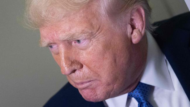 US President Donald Trump speaks to reporters aboard Air Force One while flying to Washington, DC, from Florida, on March 16, 2025, above Virginia. (Photo by Brendan Smialowski / AFP)