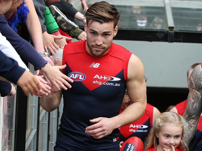 AFL Round 21. Melbourne v St Kilda at the MCG. Melbourne co captains Nathan Jones and Melbourne's Jack Viney lead the Dees out onto the MCG   . Pic: Michael Klein
