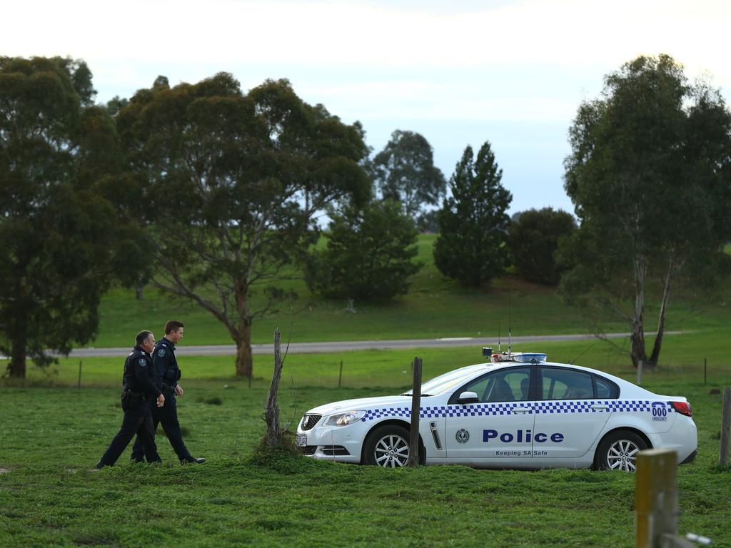 Police return to the scene of the triple murder at Hillier the day after three bodies were found. Picture: Tait Schmaal