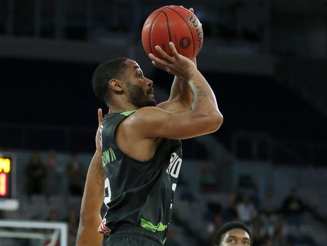 John Roberson lands a three-pointer against Cairns. Picture: Getty Images