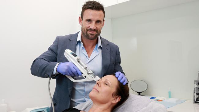 Laser Clinics medical director Jonathan Hopkirk is finding patients want body parts overly enhanced. Picture: Toby Zerna