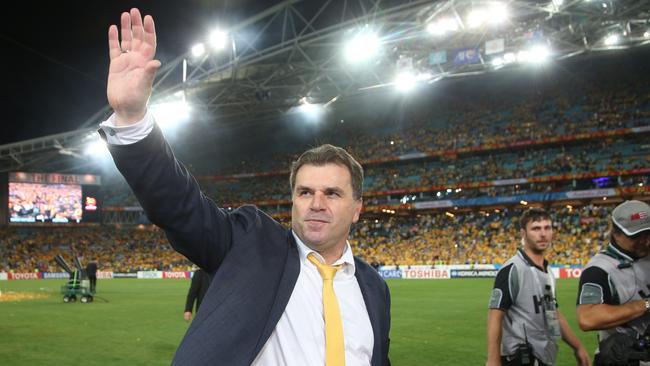 Australia's coach Ange Postecoglou waves to the crowd.