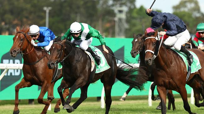 Damian Lane riding Marhoona (centre) claims the Golden Slipper from Wodeton (right) and Tempted at Rosehill. Picture: Getty Images