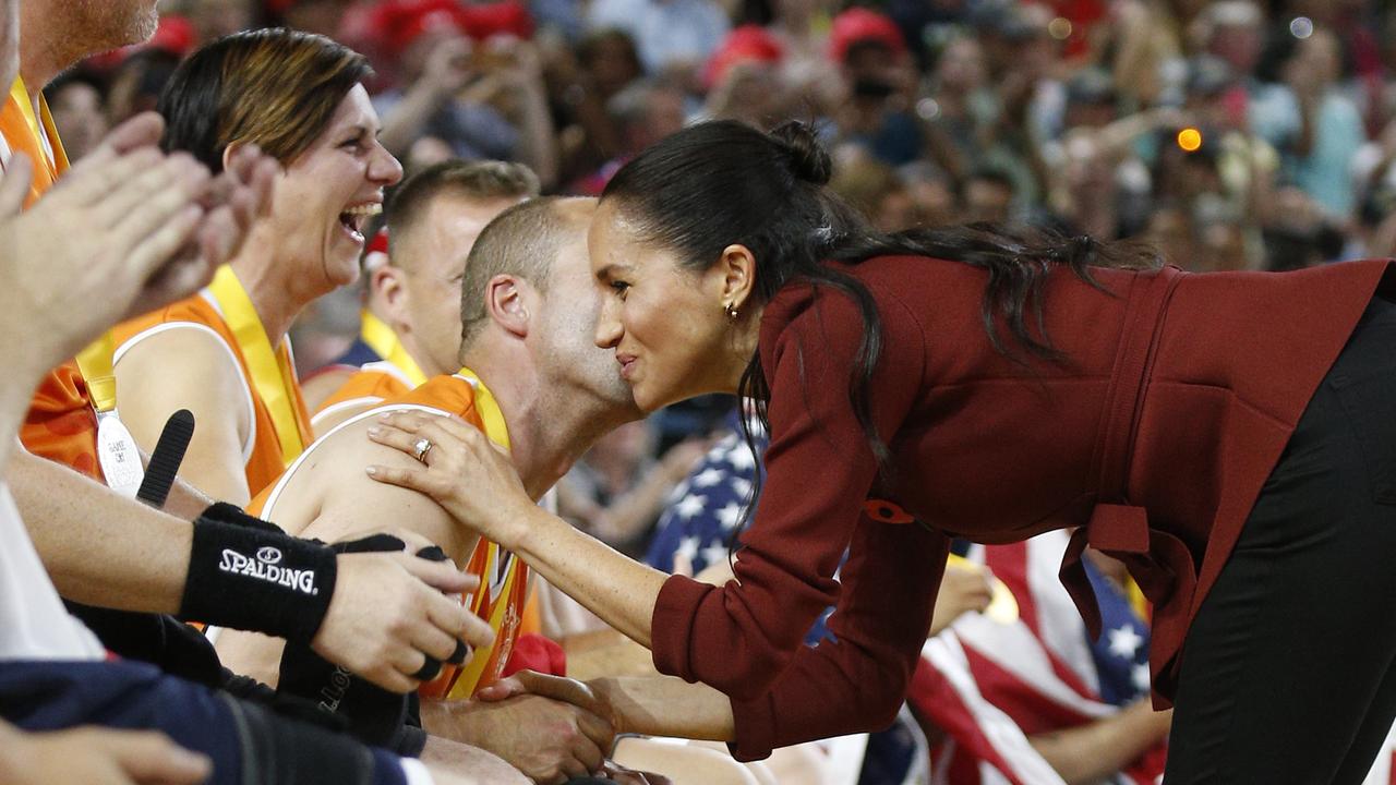 He may have been on the losing side but this cheeky Dutchman got a solid gold booby prize — a kiss from a duchess. Picture: Richard Dobson