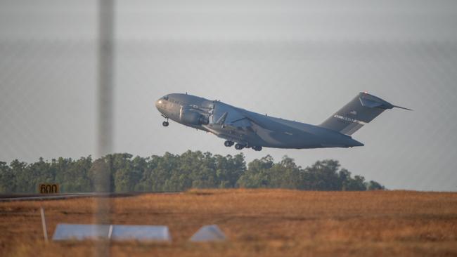 The repatriation flight departed Darwin RAAF base at 5.40pm on Monday. Picture: Pema Tamang Pakhrin