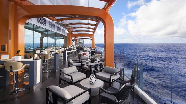 Celebrity Edge’s Magic Carpet tracks up and down the ship’s starboard side.