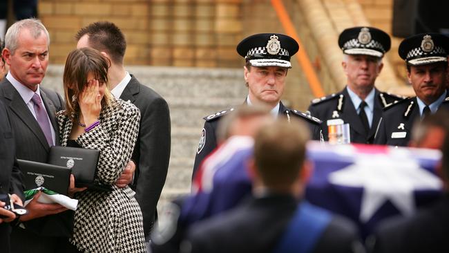 Audrey Fagan, the second highest ranking police officer in the country, put to rest in Canberra in 2007 with her daughter Clair Phillips and father Andrew Phillips looking on.