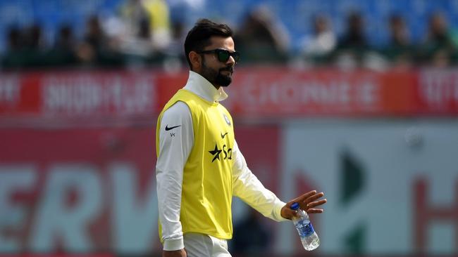 India’s Virat Kohli walks back to the pavilion after a drinks break during the first day.