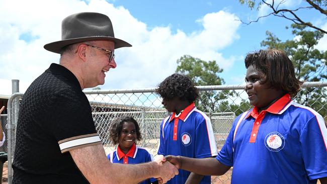 Anthony Albanese speaks to local students after touring a newly built community housing unit at Binjari.