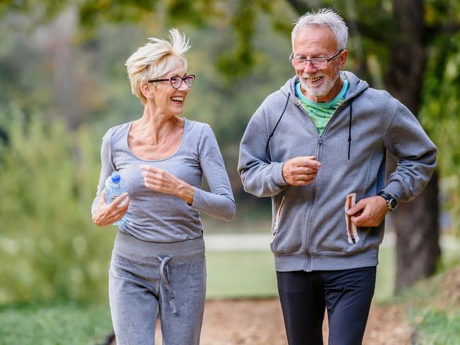 Cheerful active senior couple jogging in the park. Exercise together to stop aging. active retirement, pensioner generic