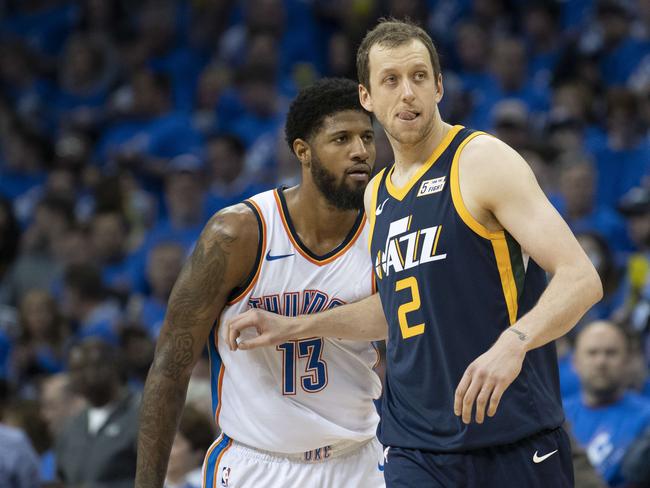 OKLAHOMA CITY, OK - APRIL 15: Joe Ingles #2 of the Utah Jazz defends against Paul George #13 of the Oklahoma City Thunder during the second half of Game 1 of the NBA Western Conference playoffs at the Chesapeake Energy Arena on April 15, 2018 in Oklahoma City, Oklahoma. NOTE TO USER: User expressly acknowledges and agrees that, by downloading and or using this photograph, User is consenting to the terms and conditions of the Getty Images License Agreement.   J Pat Carter/Getty Images/AFP == FOR NEWSPAPERS, INTERNET, TELCOS & TELEVISION USE ONLY ==