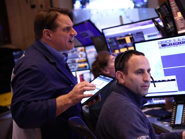 NEW YORK, NEW YORK - FEBRUARY 03: Traders work on the floor of the New York Stock Exchange during morning trading on February 03, 2025 in New York City. All three major indexes opened on a downward trajectory to start the month of February after U.S. President Donald Trump signed an executive order enacting 25% tariffs on imports from Canada and Mexico and also placing a 10% levy on imports from China.   Michael M. Santiago/Getty Images/AFP (Photo by Michael M. Santiago / GETTY IMAGES NORTH AMERICA / Getty Images via AFP)