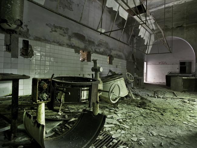 Stuck in time ... the kitchen still covered in asbestos on the haunted Poveglia Island. Picture: Ella Pellegrini