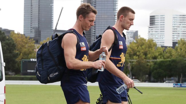 Lincoln McCarthy and Harris Andrews head for the bus after training. Picture: Michael Klein