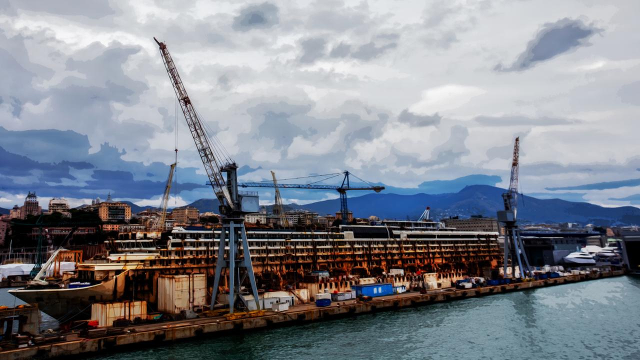 Another picture shows the cruise beached at her home port with cranes ready to strip the scrap off the ship. Picture: istock