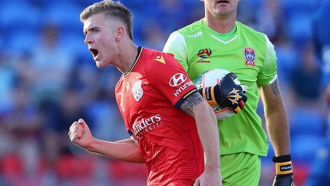 Riley McGree celebrates the first of his two goals in the come-from-behind triumph away to Newcastle Jets. Picture: Tony Feder/Getty Images