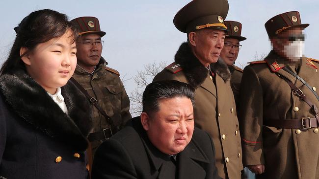 Kim Jong-un, centre,and his daughter observe a warhead missile launch exercise simulating a tactical nuclear attack in Cheolsan county, North Pyongan Province. Picture: AFP