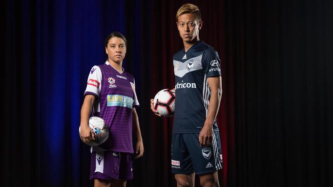 Perth Glory’s Sam Kerr and Keisuke Honda from Melbourne Victory pose at Fox Studios yesterday