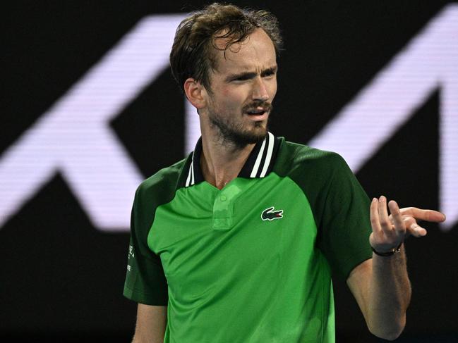 Russia's Daniil Medvedev reacts as he plays against Finland's Emil Ruusuvuori during their men's singles match on day five of the Australian Open tennis tournament in Melbourne early on January 19, 2024. (Photo by Anthony WALLACE / AFP) / -- IMAGE RESTRICTED TO EDITORIAL USE - STRICTLY NO COMMERCIAL USE --