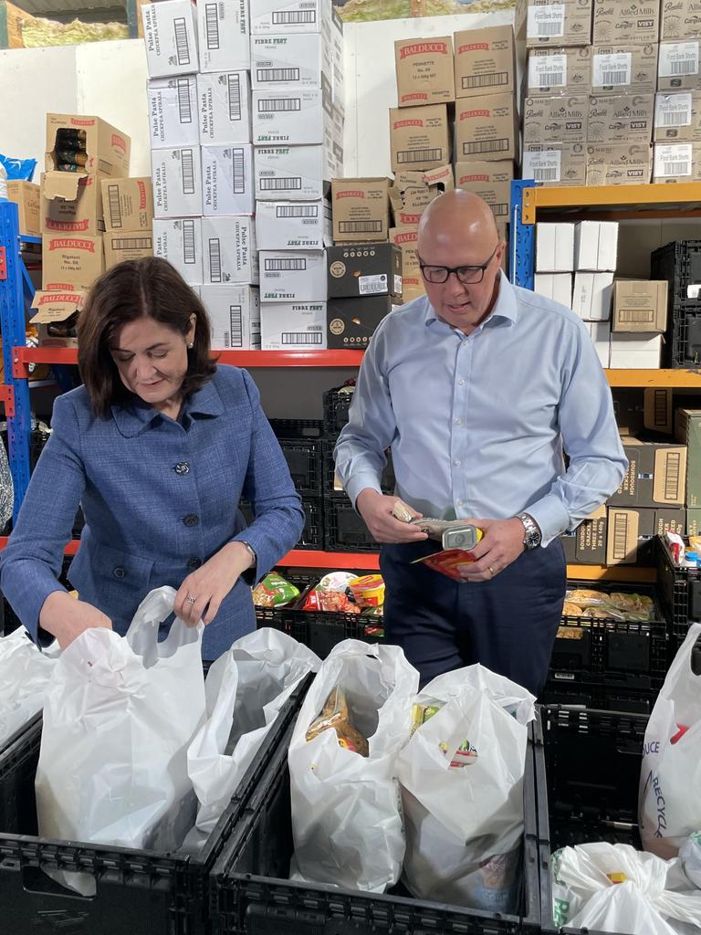 Senator Sarah Henderson and Liberal leader Peter Dutton lend a hand at Feed Me’s Ocean Grove base.