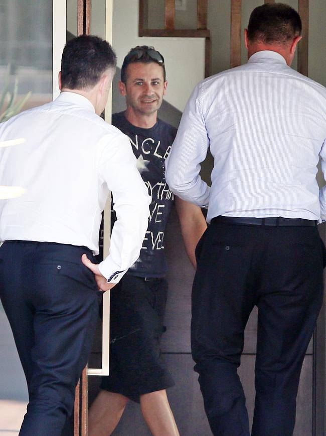 Detectives at the Dover Heights home on Thursday. Picture: Richard Dobson