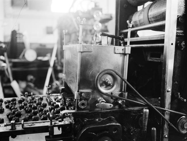 Chocolates roll along a conveyor belt at the MacRobertson’s chocolate factory circa 1940. Picture: State Library of Victoria