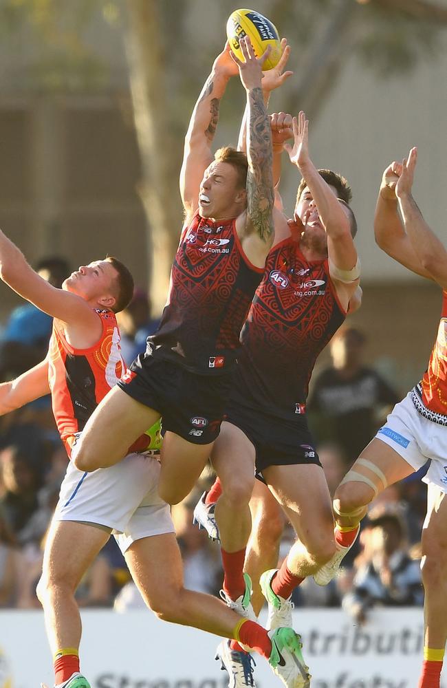 James Harmes flies for a mark over Steven May. Picture: Getty Images