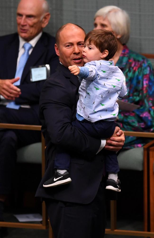 Treasurer Josh Frydenberg holds son Blake before handing down his first Federal Budget in the House of Representatives. Picture: AAP