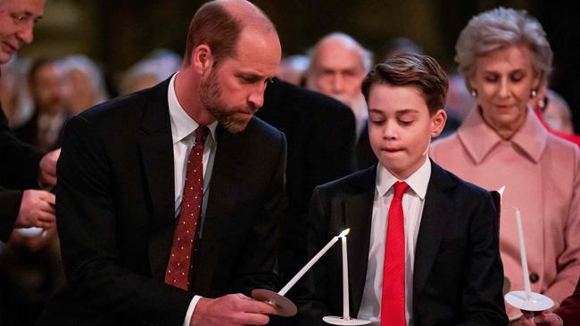 Britain's Prince William, Prince of Wales (L) and Britain's Prince George of Wales attend the 