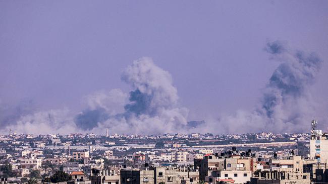 Huge plumes of smoke rise over Khan Yunis as seen from the city of Rafah, in the southern Gaza Strip on Saturday. Picture: AFP