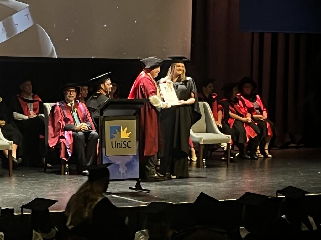 Graduates from the University of the Sunshine Coast's Fraser Coast campus celebrating at the Brolga Theatre.