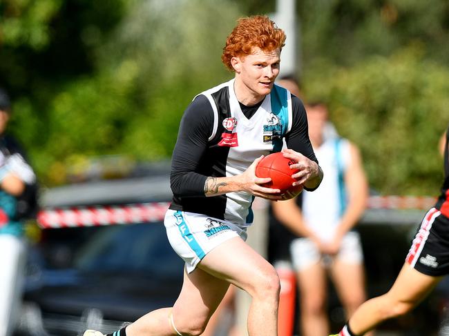 Mitchell Hearne of Hillside runs with the ball during the round two EDFL Strathmore Community Bank Division One Seniors match between West Coburg and Hillside at Shore Reserve, on April 20, 2024, in Melbourne, Australia. (Photo by Josh Chadwick)