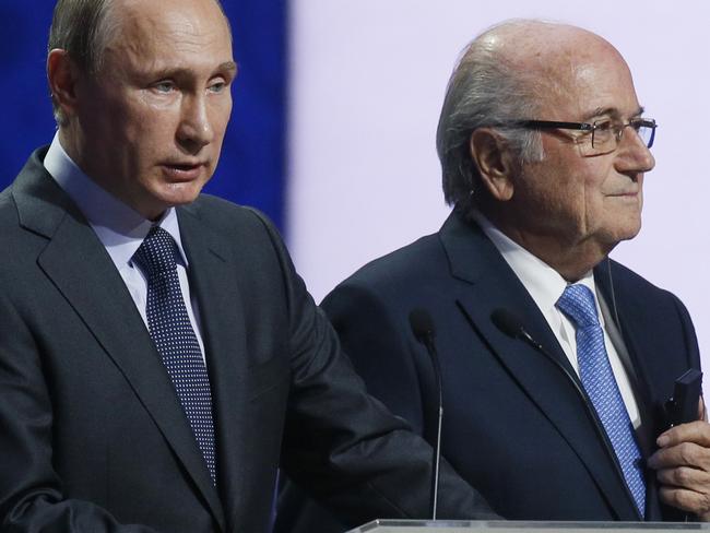 Russian President Vladimir Putin, left, speaks as FIFA President Sepp Blatter listens during the preliminary draw for the 2018 soccer World Cup in Konstantin Palace in St. Petersburg, Russia, Saturday, July 25, 2015. (AP Photo/Dmitry Lovetsky