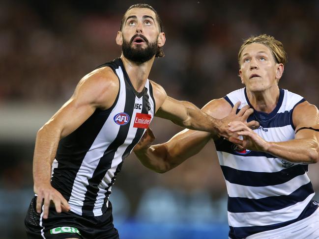 AFL Round 1. 22/03/2019. Collingwood vs Geelong at the MCG. Brodie Grundy of the Magpies and Rhys Stanley of the Cats boundary throw in. Pic: Michael Klein.