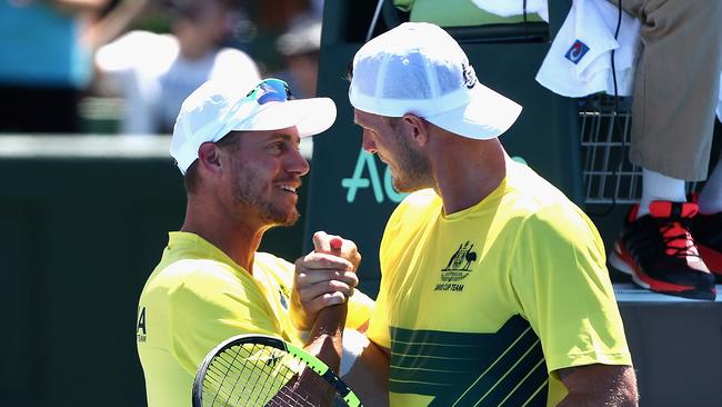 Mates: Lleyton Hewitt congratulates Sam Groth after a Davis Cup doubles victory. Picture: Getty