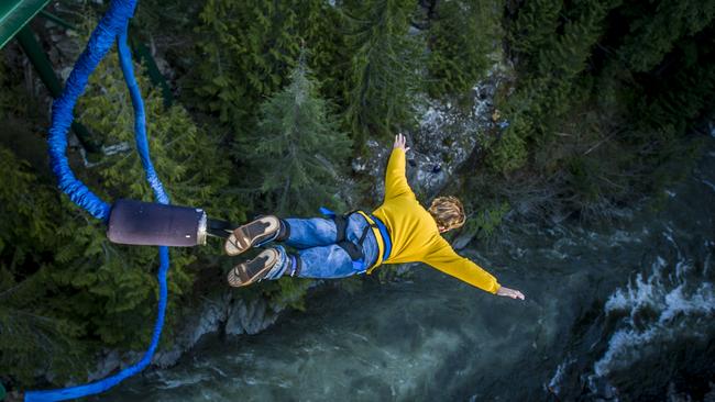 Young man bungee jumping over river.Escape 16 June 2024NewsPhoto - iStock