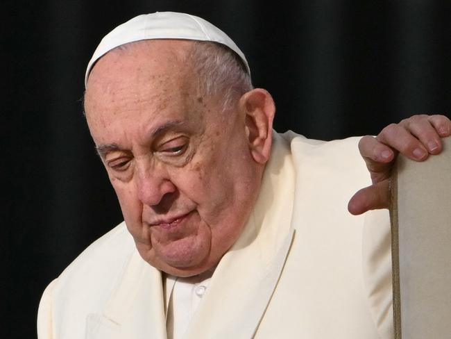 (FILES) Pope Francis arrives for the weekly general audience at St Peter's Square in The Vatican on November 13, 2024. Pope Francis's condition "continues to be critical", the Vatican said on February 22, 2025, explaining that he was alert and in his armchair but also required "high-flow oxygen" and blood transfusions. (Photo by Alberto PIZZOLI / AFP)