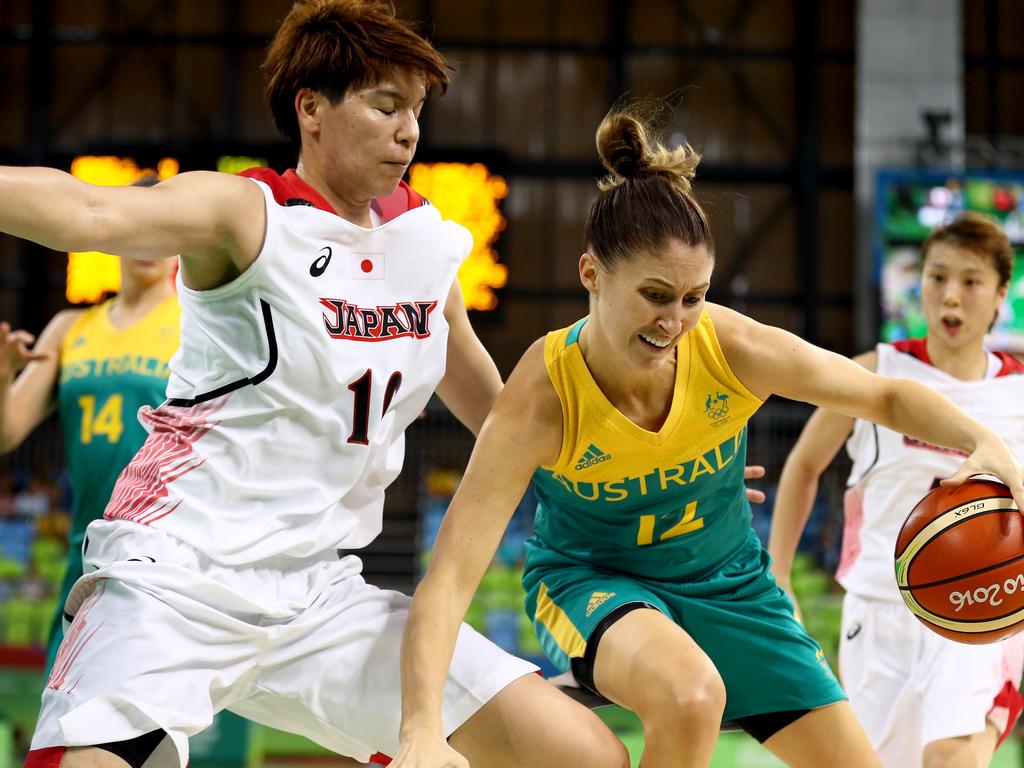 RIO DE JANEIRO, BRAZIL - AUGUST 11: Katie Rae Ebzery #12 of Australia drives into Ramu Tokashiki #10 of Japan during a Women's Preliminary Group A match on Day 6 of the Rio 2016 Olympics at the Youth Arena on August 11, 2016 in Rio de Janeiro, Brazil. (Photo by Sean M. Haffey/Getty Images)