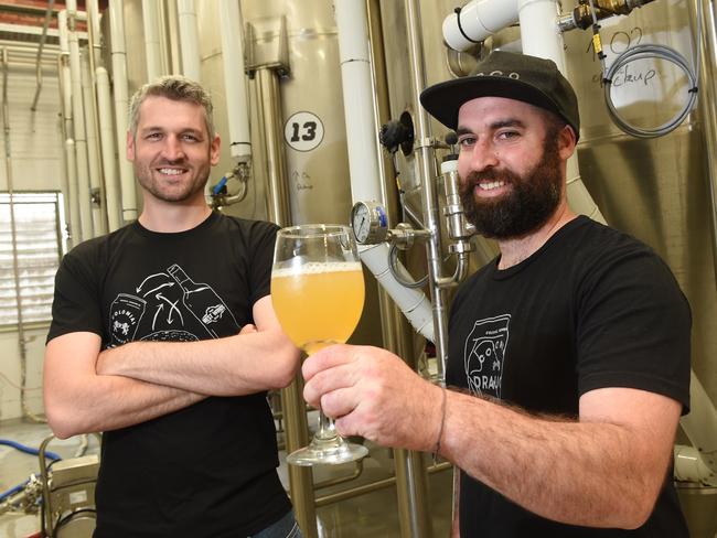 Ash Hazell and Jarrod Stivala among the fermentation vats at the brewery. Picture: Chris Eastman