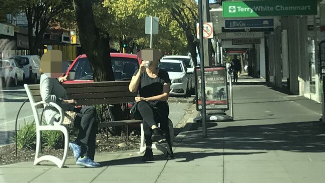 People enjoying coffee on Bay St in North Brighton.