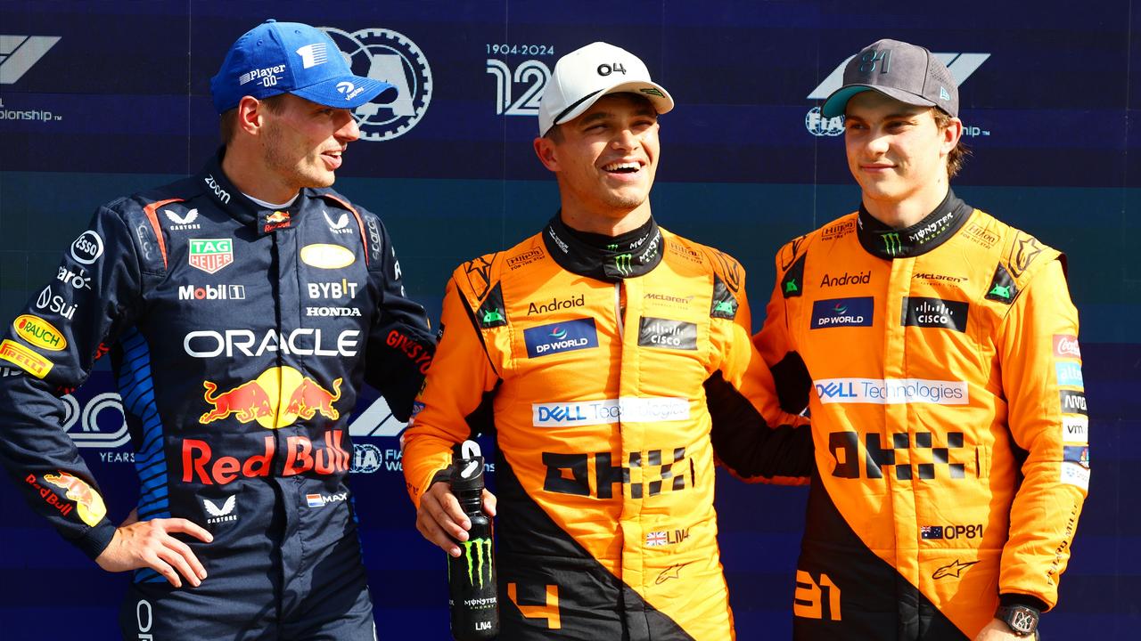 ZANDVOORT, NETHERLANDS - AUGUST 24: Second placed qualifier Max Verstappen of the Netherlands and Oracle Red Bull Racing, pole position qualifier Lando Norris of Great Britain and McLaren and third placed qualifier Oscar Piastri of Australia and McLaren react in parc ferme after qualifying ahead of the F1 Grand Prix of Netherlands at Circuit Zandvoort on August 24, 2024 in Zandvoort, Netherlands. (Photo by Mark Thompson/Getty Images)