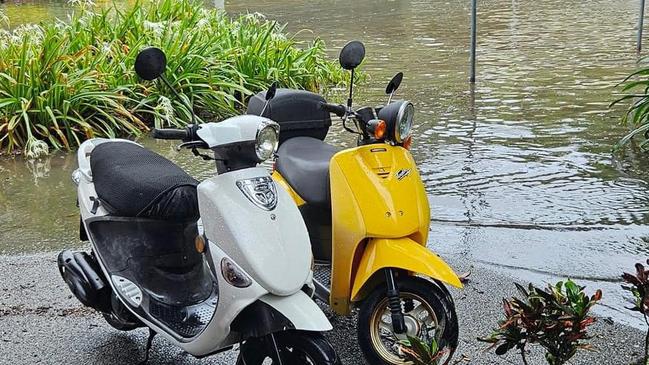 Scooters near the submerged Marlin Parade.