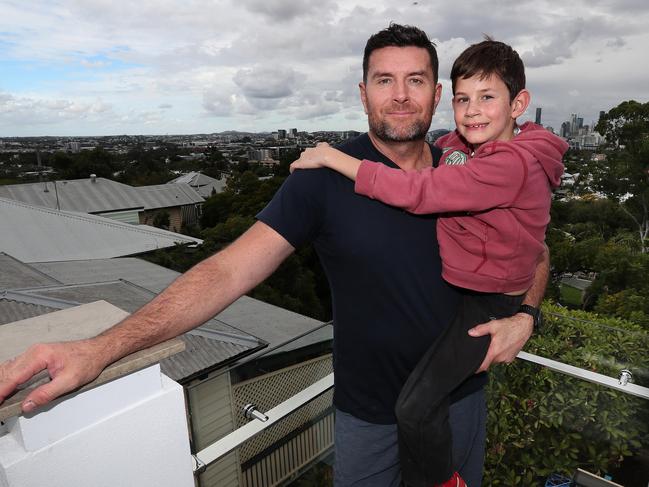 Bill McDonald with son James, 8, at his home in Windsor. Picture: Annette Dew