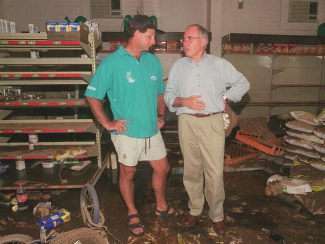 Former prime minister John Howard talks to Five Star shopkeeper Neil Croft after the 1998 flood that devastated Katherine following Cyclone Les.