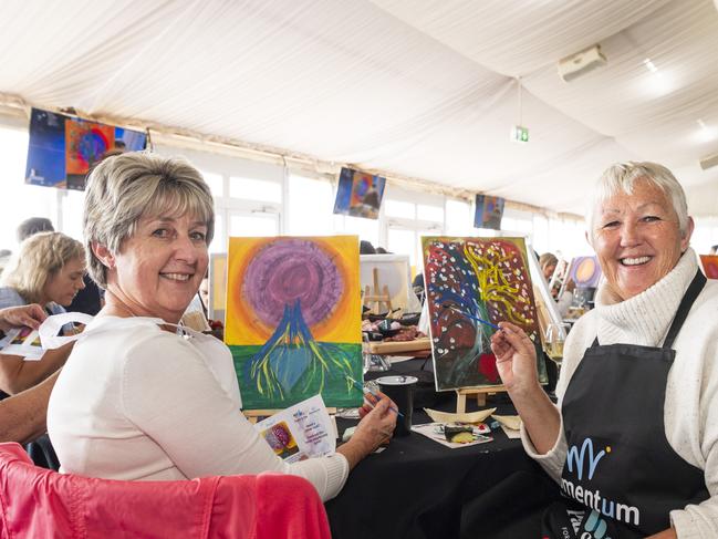 Aletta Barry (left) and Sian Rensford participating in the World's Largest Paint and Sip Luncheon for Momentum Mental Health at Clifford Park racecourse, Friday, June 21, 2024. Picture: Kevin Farmer