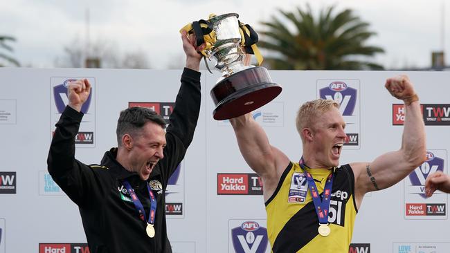 Craig McRae and Steve Morris of the Tigers hold the premiership cup after winning the VFL Grand Final match for Richmond. Picture: Scott Barbour