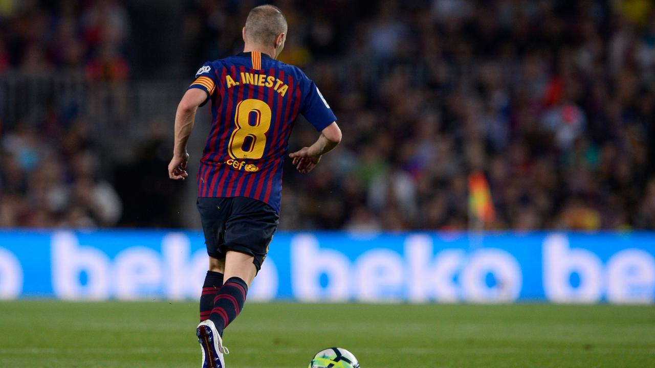 Barcelona's Spanish midfielder Andres Iniesta controls the ball during the Spanish league football match between FC Barcelona and Real Sociedad at the Camp Nou stadium in Barcelona on May 20, 2018. Iniesta, who joined Barcelona's academy 22 years ago, played his final game for the club. / AFP PHOTO / Josep LAGO