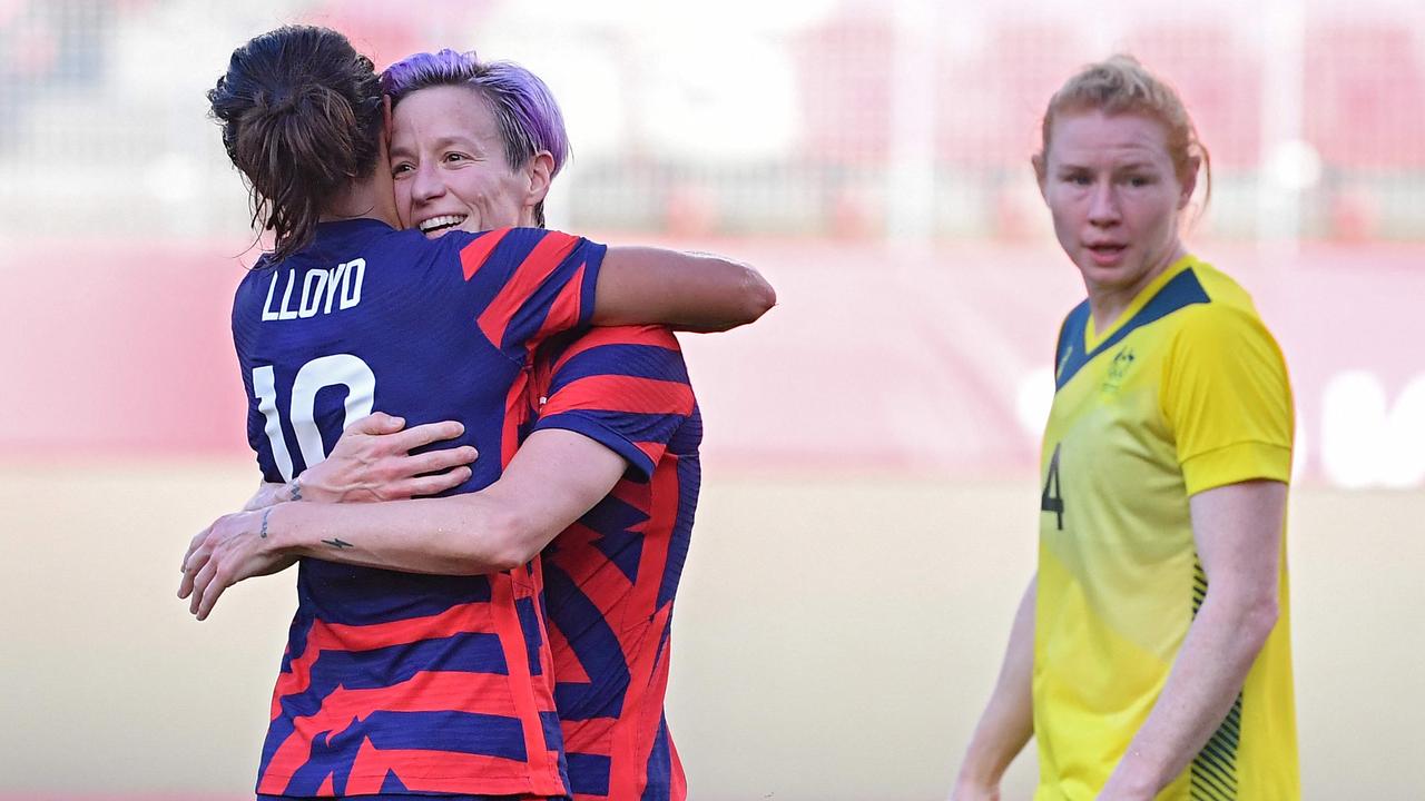 USA forward Megan Rapinoe is congratulated by teammate forward Carli Lloyd after scoring, as Australia's defender Clare Polkinghorne reacts. Picture: AFP