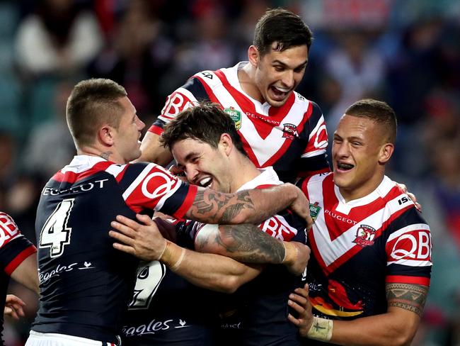 Roosters Aiden Guerra celebrates scoring a try with his team mates during the round 24 NRL game between the Sydney Roosters and the St George Illawarra Dragons at Allianz Stadium . Picture : Gregg Porteous