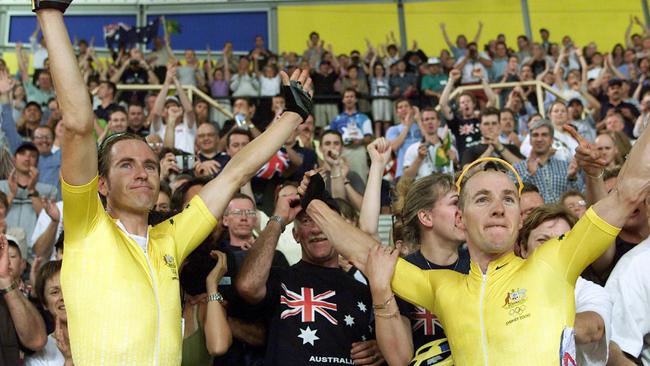 Australian cyclists Scott McGrory and Brett Aitken celebrate winning gold in the Sydney 2000 Olympic Games madison track final. Picture: Phil Hillyard